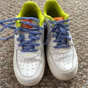 Nike Kids White Sneakers with Blue and Yellow Accents